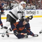 
              Los Angeles Kings' Matt Roy (3) checks Edmonton Oilers' Zach Hyman (18) during the second period of Game 1 of an NHL hockey Stanley Cup first-round playoff series, Monday, May 2, 2022 in Edmonton, Alberta. (Jason Franson/The Canadian Press via AP)
            