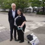 
              Roger Penske talks with Barbara Hellyer in the plaza before practice for the Indianapolis 500 auto race at Indianapolis Motor Speedway, Thursday, May 19, 2022, in Indianapolis. wld(AP Photo/Darron Cummings)
            