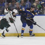 
              St. Louis Blues' Pavel Buchnevich (89) works the puck against Minnesota Wild's Mats Zuccarello (36) during the first period in Game 4 of an NHL hockey Stanley Cup first-round playoff series on Sunday, May 8, 2022, in St. Louis. (AP Photo/Michael Thomas)
            