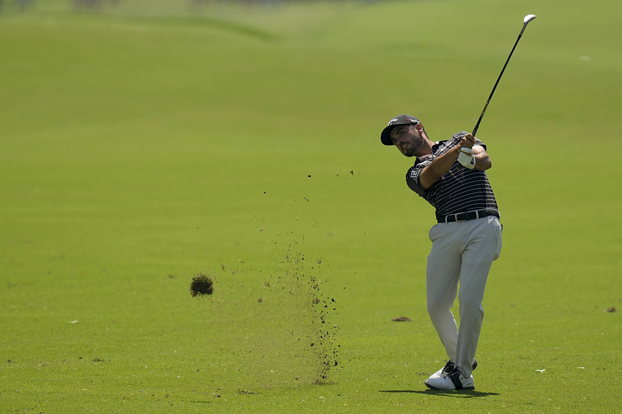 Abraham Ancer, of Mexico, hits from the fairway on the 13th hole during the first round of the PGA ...