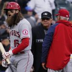 
              Los Angeles Angels' Brandon Marsh, left, reacts after being called out on strikes as manager Joe Maddon, right, argues with home plate umpire Larry Vanover during the eighth inning of a baseball game against the Chicago White Sox in Chicago, Saturday, April 30, 2022. (AP Photo/Nam Y. Huh)
            