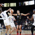 
              Las Vegas Aces guard Kelsey Plum (10) loses control of the ball as she is guarded by Minnesota Lynx guard Evina Westbrook (2), guard Rachel Banham (15) and center Sylvia Fowles (34) during a WNBA basketball game in Las Vegas on Thursday, May 19, 2022. (Steve Marcus/Las Vegas Sun via AP)
            