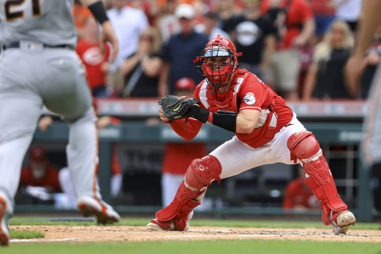 Cincinnati Reds' Tyler Stephenson waits to tag out San Francisco Giants' Joey Bart at home plate to...
