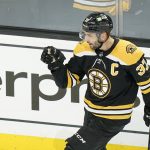 
              Boston Bruins' Patrice Bergeron (37) celebrates after scoring in the first period of Game 4 of an NHL hockey Stanley Cup first-round playoff series against the Carolina Hurricanes, Sunday, May 8, 2022, in Boston. (AP Photo/Steven Senne)
            