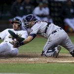 
              Oakland Athletics' Ramon Laureano, left, is tagged out by Houston Astros catcher Jason Castro during the fifth inning of a baseball game in Oakland, Calif., Tuesday, May 31, 2022. (AP Photo/Jed Jacobsohn)
            