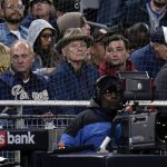 
              Actor Bill Murray, center, looks on as the Chicago Cubs play the San Diego Padres in a baseball game Tuesday, May 10, 2022, in San Diego. (AP Photo/Gregory Bull)
            