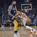 
              Golden State Warriors guard Stephen Curry (30) dribbles around Memphis Grizzlies center Steven Adams (4) during the first half of Game 4 of an NBA basketball Western Conference playoff semifinal in San Francisco, Monday, May 9, 2022. (AP Photo/Tony Avelar)
            