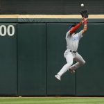 
              Chicago Cubs center fielder Christopher Morel catches a fly ball against the outfield wall hit by Chicago White Sox's Jake Burger during the eighth inning of a baseball game at Guaranteed Rate Field, Sunday, May 29, 2022, in Chicago. (AP Photo/Paul Beaty)
            