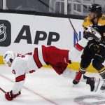 
              Boston Bruins' David Pastrnak (88) checks Carolina Hurricanes' Brett Pesce (22) during the first period of Game 3 of an NHL hockey Stanley Cup first-round playoff series, Friday, May 6, 2022, in Boston. (AP Photo/Michael Dwyer)
            