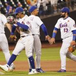 
              New York Mets' Pete Alonso (20), Francisco Lindor (12), Eduardo Escobar and Luis Guillorme (13) celebrate after defeating the Washington Nationals in a baseball game, Monday, May 30, 2022, in New York. (AP Photo/Mary Altaffer)
            