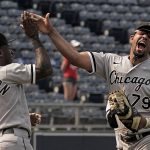 
              Chicago White Sox's Jose Abreu (79) and Tim Anderson (7) celebrate after the first game of a baseball doubleheader against the Kansas City Royals Tuesday, May 17, 2022, in Kansas City, Mo. The White Sox won 3-0. (AP Photo/Charlie Riedel)
            
