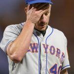 
              New York Mets starting pitcher Chris Bassitt rubs his head while walking off the field after being removed during the fifth inning of the team's baseball game against the San Francisco Giants in San Francisco, Tuesday, May 24, 2022. (AP Photo/Tony Avelar)
            