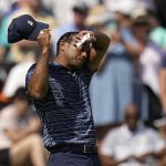 
              Tiger Woods wipes his face on the 18th hole during the first round of the PGA Championship golf tournament, Thursday, May 19, 2022, in Tulsa, Okla. (AP Photo/Eric Gay)
            