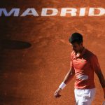 
              Novak Djokovic walks in the court during a men's semifinal against Carlos Alcaraz at the Mutua Madrid Open tennis tournament in Madrid, Spain, Saturday, May 7, 2022. (AP Photo/Manu Fernandez)
            
