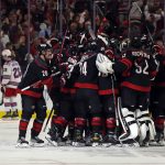 
              Carolina Hurricanes celebrate an overtime goal by Ian Cole against the New York Rangers in Game 1 of an NHL hockey Stanley Cup second-round playoff series in Raleigh, N.C., Wednesday, May 18, 2022. (AP Photo/Karl B DeBlaker)
            