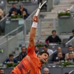 
              Serbia's Novak Djokovic servers against Gael Monfils, of France, during their match at the Mutua Madrid Open tennis tournament in Madrid, Spain, Tuesday, May 3, 2022. (AP Photo/Manu Fernandez)
            