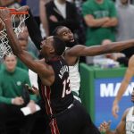 
              Miami Heat's Bam Adebayo (13) dunks against Boston Celtics' Jaylen Brown during the second half of Game 3 of the NBA basketball playoffs Eastern Conference finals Saturday, May 21, 2022, in Boston. (AP Photo/Michael Dwyer)
            