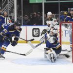 
              St. Louis Blues' Ville Husso (35) makes a save against the Minnesota Wild during the first period in Game 3 of an NHL hockey Stanley Cup first-round playoff series Friday, May 6, 2022, in St. Louis. (AP Photo/Michael Thomas)
            