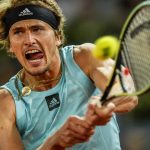 
              Alexander Zverev of Germany returns the ball against Greece's Stefanos Tsitsipas during a men's semifinal at the Mutua Madrid Open tennis tournament in Madrid, Spain, Saturday, May 7, 2022. (AP Photo/Manu Fernandez)
            