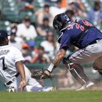 
              Detroit Tigers' Jonathan Schoop (7) avoids the tag of Minnesota Twins catcher Gary Sanchez (24 in the seventh inning of a baseball game in Detroit, Monday, May 30, 2022. Sanchez ended up making the tag for the out. (AP Photo/Paul Sancya)
            