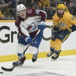 
              Colorado Avalanche right wing Nicolas Aube-Kubel (16) moves the puck ahead of Nashville Predators' Alexandre Carrier (45) during the first period in Game 4 of an NHL hockey first-round playoff series Monday, May 9, 2022, in Nashville, Tenn. (AP Photo/Mark Humphrey)
            