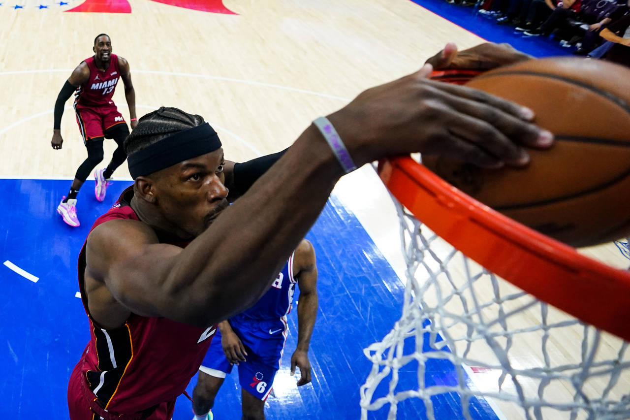 Miami Heat's Jimmy Butler dunks against the Philadelphia 76ers during the second half of Game 6 of ...
