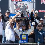 
              Chase Elliott, center, holds up his trophy after a NASCAR Cup Series auto race at Dover Motor Speedway, Monday, May 2, 2022, in Dover, Del. (AP Photo/Jason Minto)
            