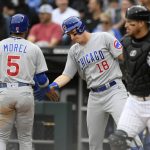 
              Chicago Cubs' Christopher Morel (5) celebrates with teammate Frank Schwindel (18) at home plate after scoring on a Patrick Wisdom double during the first inning of a baseball game against the Chicago White Sox at Guaranteed Rate Field, Saturday, May 28, 2022, in Chicago. (AP Photo/Paul Beaty)
            
