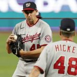 
              Washington Nationals pitching coach Jim Hickey (48) approaches the mound to talk with starting pitcher Aaron Sanchez during the second inning of a baseball game against the Miami Marlins, Monday, May 16, 2022, in Miami. (AP Photo/Lynne Sladky)
            