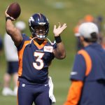 
              Denver Broncos quarterback Russell Wilson takes part in drills at the NFL football team's voluntary minicamp Wednesday, April 27, 2022, at the team's headquarters in Englewood, Colo. (AP Photo/David Zalubowski)
            