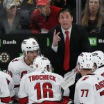 
              Carolina Hurricanes head coach Rod Brind'Amour, top, speaks to his team during a timeout in the third period of Game 3 of an NHL hockey Stanley Cup first-round playoff series against the Boston Bruins, Friday, May 6, 2022, in Boston. (AP Photo/Michael Dwyer)
            