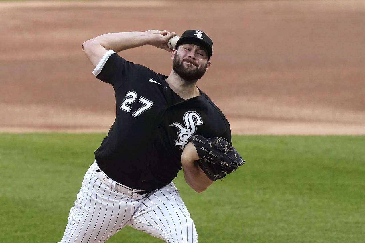 Chicago White Sox's Lucas Giolito delivers during the first inning of a baseball game against the C...