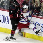 
              Carolina Hurricanes defenseman Brendan Smith (7) checks New York Rangers center Filip Chytil (72) during the first period during Game 2 of an NHL hockey Stanley Cup second-round playoff series Friday, May 20, 2022, in Raleigh, N.C. (AP Photo/Chris Seward)
            