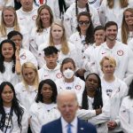 
              Members of Team USA listen as President Joe Biden speaks during an event with the Tokyo 2020 Summer Olympic and Paralympic Games, and Beijing 2022 Winter Olympic and Paralympic Games, on the South Lawn of the White House, Wednesday, May 4, 2022, in Washington. (AP Photo/Evan Vucci)
            