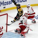 
              Boston Bruins' Brad Marchand (63) celebrates after scoring on Carolina Hurricanes goalie Antti Raanta (32) during the second period in Game 6 of an NHL hockey Stanley Cup first-round playoff series Thursday, May 12, 2022, in Boston. (AP Photo/Michael Dwyer)
            