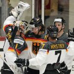 
              Germany's keeper Dustin Strahlmeier is celebrated by the team after winning the group A Hockey World Championship match between Kazakhstan and Germany in Helsinki, Finland, Sunday May 22 2022. (AP Photo/Martin Meissner)
            