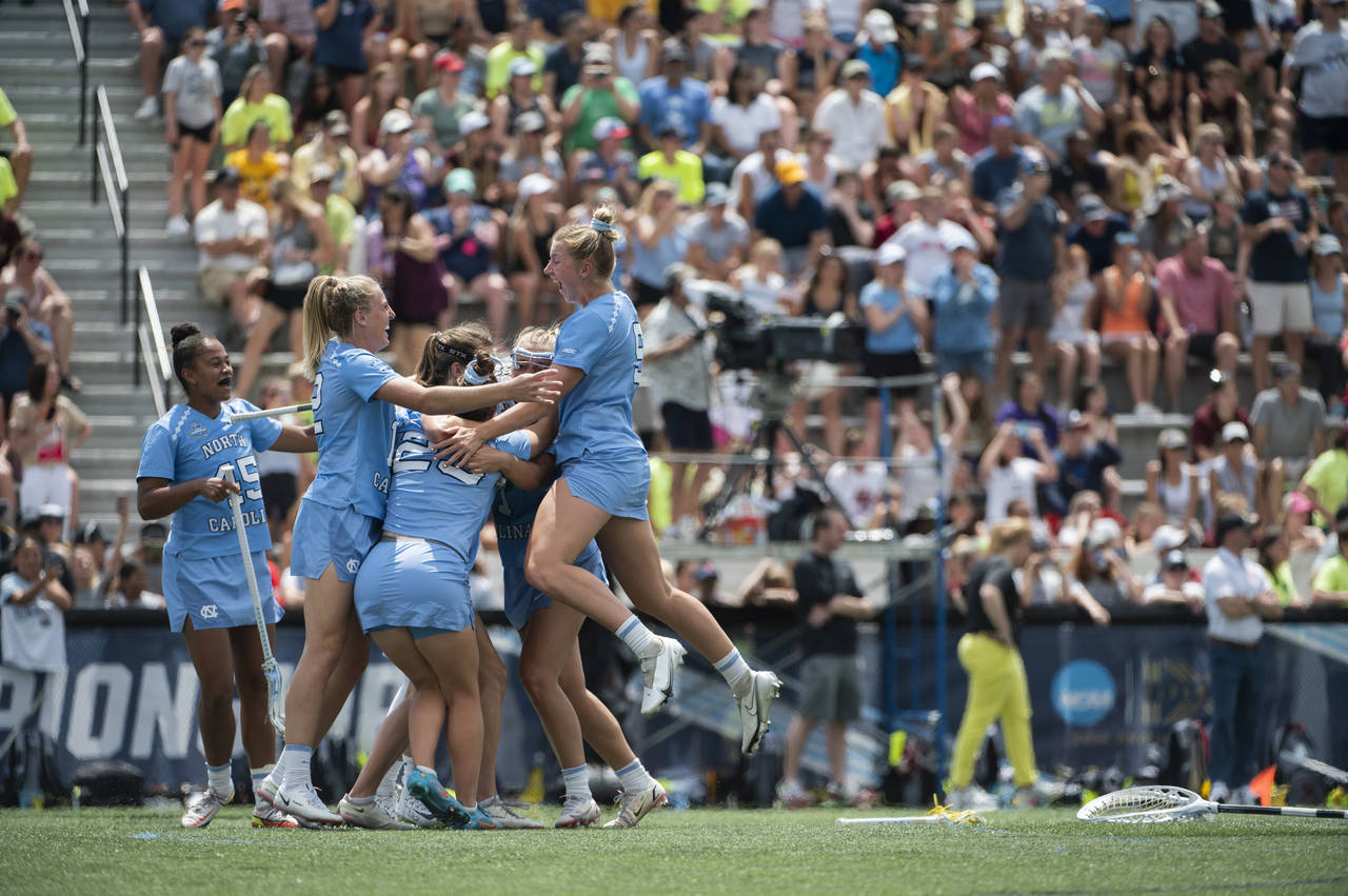 North Carolina players celebrate after winning the NCAA college Division 1 women's lacrosse champio...