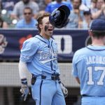 
              North Carolina's Vance Honeycutt celebrates hit two-run home run against the NC State during the first inning in an NCAA college baseball game at the Atlantic Coast Conference tournament final Sunday, May 29, 2022, in Charlotte, N.C. (AP Photo/Chris Carlson)
            