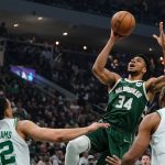 
              Milwaukee Bucks' Giannis Antetokounmpo shoots over Boston Celtics' Grant Williams and Al Horford during the first half of Game 6 of an NBA basketball Eastern Conference semifinals playoff series Friday, May 13, 2022, in Milwaukee . (AP Photo/Morry Gash)
            