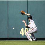 
              San Francisco Giants center fielder Austin Slater (13) is unable to catch a fly ball hit by St. Louis Cardinals' Paul Goldschmidt during the seventh inning of a baseball game Saturday, May 14, 2022, in St. Louis. (AP Photo/Scott Kane)
            