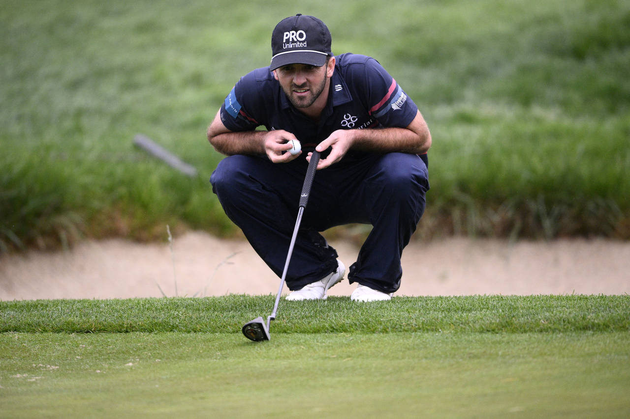 Denny McCarthy lines up a shot on the 16th green during the second round of the Wells Fargo Champio...