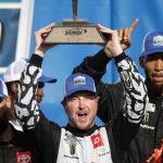 
              Kurt Busch celebrates in Victory Lane after winning a NASCAR Cup Series auto race at Kansas Speedway in Kansas City, Kan., Sunday, May 15, 2022. (AP Photo/Colin E. Braley)
            