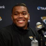 
              Travon Walker, the Jacksonville Jaguars first round pick and No. 1 overall in the NFL football draft, smiles during a press conference, Friday, April 29, 2022. at TIAA Bank Field in Jacksonville, Fla. (Corey Perrine/The Florida Times-Union via AP)
            