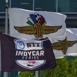 
              Indianapolis Motor Speedway and IndyCar Series flags fly in heavy winds during practice for the IndyCar 500 auto race at Indianapolis Motor Speedway in Indianapolis, Friday, May 20, 2022. (AP Photo/Michael Conroy)
            