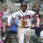 
              Atlanta Braves catcher William Contreras (24) celebrates after a home run in the fifth inning of a baseball game against the Milwaukee Brewers, Sunday, May 8, 2022, in Atlanta. (AP Photo/Brett Davis)
            