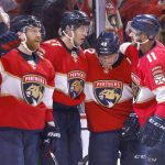 
              Florida Panthers left wing Jonathan Huberdeau (11), defenseman Gustav Forsling (42), center Eetu Luostarinen (27) and right wing Claude Giroux (28) celebrate a goal against the Tampa Bay Lightning during the second period of Game 2 of an NHL hockey second-round playoff series Thursday, May 19, 2022, in Sunrise, Fla. (AP Photo/Reinhold Matay)
            