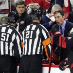 
              Carolina Hurricanes head coach Rod Brind'Amour, upper right, talks with officials to explain a call during the first period of Game 1 of an NHL hockey Stanley Cup first-round playoff series against the Boston Bruins in Raleigh, N.C., Monday, May 2, 2022. (AP Photo/Karl B DeBlaker)
            