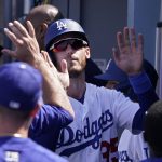 
              Los Angeles Dodgers' Cody Bellinger is congratulated by teammates in the dugout after scoring on a fielding error on a hit by Gavin Lux during the sixth inning of a baseball game against the Detroit Tigers Sunday, May 1, 2022, in Los Angeles. (AP Photo/Mark J. Terrill)
            