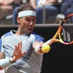 
              Rafael Nadal returns the ball to John Isner during their match at the Italian Open tennis tournament, in Rome, Wednesday, May 11, 2022. (AP Photo/Andrew Medichini)
            