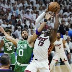 
              Miami Heat center Bam Adebayo (13) and Boston Celtics forward Jayson Tatum (0) go after a rebound during the first half of Game 7 of the NBA basketball Eastern Conference finals playoff series, Sunday, May 29, 2022, in Miami. (AP Photo/Lynne Sladky)
            